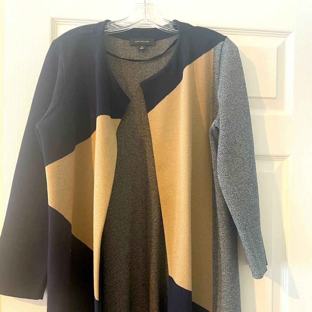 Ann Taylor over coat. Great for office. Goes great with navy pants or bluejeans.